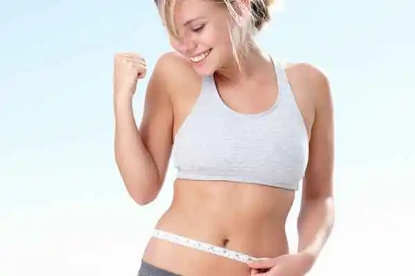 woman happy after fat reduction treatment Derby