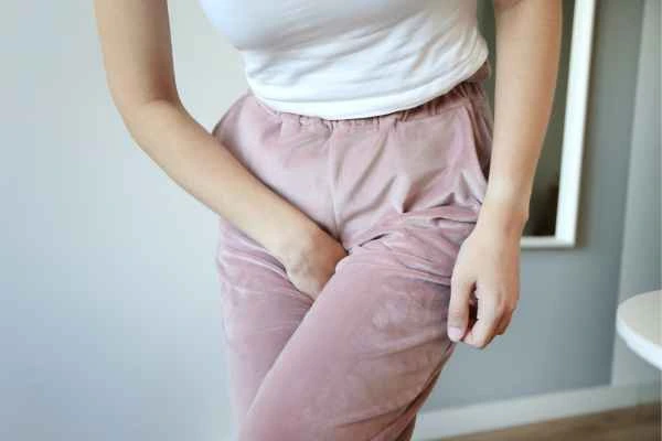 older woman running to the toilet because of urinary incontinence Derby