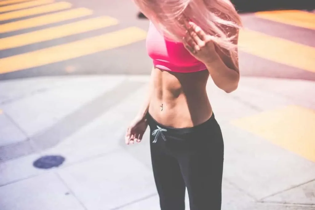 Woman with toned stomach after LA-EMS Body Sculpting Treatment Derby 